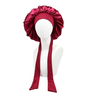 Burgundy satin sleep bonnet with long ribbons and pleated design for hair care