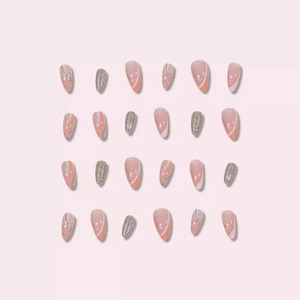 Pink gradient almond press-on nails with silver glitter stars and white swirl designs