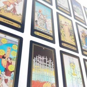 Detail view of classic tarot cards with black borders and artistic Rider Waite illustrations