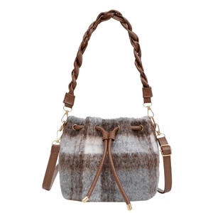 Plaid wool bucket bag featuring woven handle and brown drawstring on white background