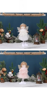 Detail of Christmas angel tree ornaments with soft tulle skirts and sparkly wings