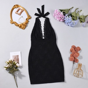 Detail of black lace halter dress with deep V-neckline and intricate floral lace trim