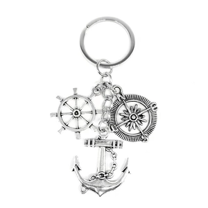 Vintage nautical keychain featuring silver compass, ship wheel, and anchor pendants