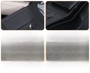 Close-up of the fine stitching and smooth metal zipper on black crocodile leather wallet