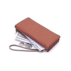 Detail view of the brown lychee pattern leather wallet with dual zippers and wrist strap