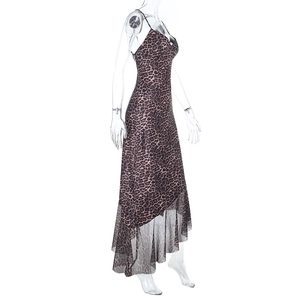 Detail of leopard print dress featuring mesh patchwork and asymmetrical ruffle hemline