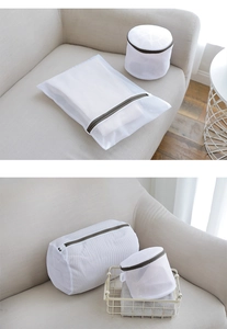 Close-up of durable white mesh laundry bags with grey zippers for protecting delicates