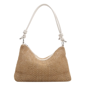 Handwoven straw tote bag with decorative white rope handles and knots for summer