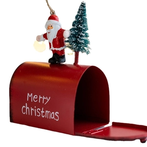Red metal Christmas mailbox hanging ornament with Santa Claus and a miniature pine tree