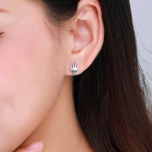 Retro S925 sterling silver palm stud earrings worn on ear with polished finish