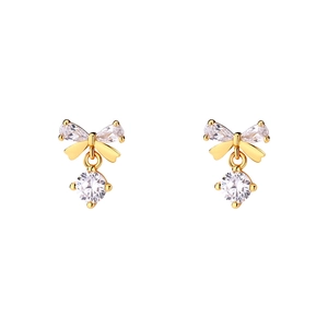 Exquisite S999 silver bow earrings in gold with sparkling zircons on white background