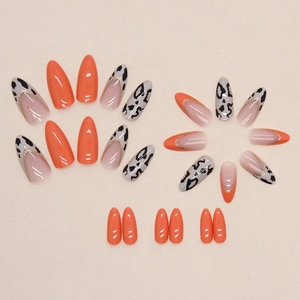 Pumpkin orange long almond press-on nails with leopard print and glitter French tips