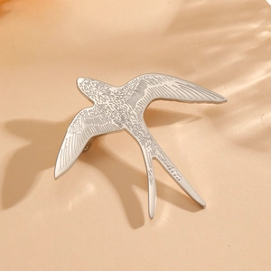 S925 silver swallow bird animal shaped brooch for suits and jackets on warm background