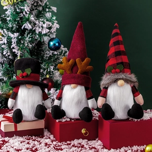 Three Nordic Christmas gnomes with plaid hats and white beards as festive holiday decor