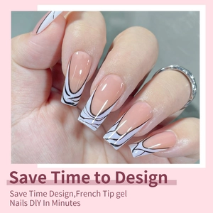 Detail of pink long square press-on nails with black and white abstract French tips