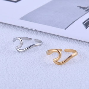 Minimalist wavy titanium steel open rings in gold and silver finishes with a polished look