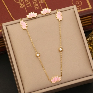 Pink lotus jewelry set with gold necklace and earrings featuring enamel and zircon accents