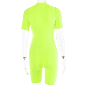 Back view of neon green short sleeve bodysuit with sporty elastic fabric on mannequin