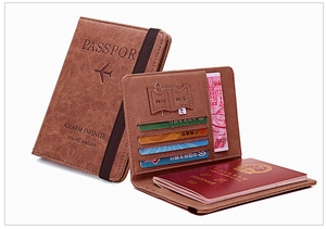 Internal layout of brown PU leather RFID passport holder with card slots and elastic strap