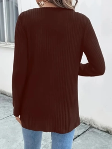 Back view of dark brown knitted jacket showing vertical ribbed texture and long sleeves