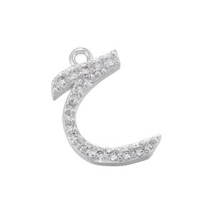 Macro shot of silver Arabic Haa letter pendant with shimmering cubic zirconia settings