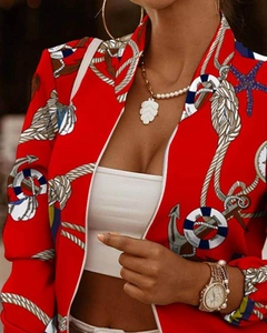Detail of red zip-up jacket featuring white nautical anchor and lifebuoy prints