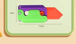 Detail showing the 11cm by 4cm dimensions of the purple and green 3D gravity fidget toy