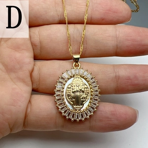 Macro detail of Guadalupe pendant with white mother-of-pearl and sparkling zircons