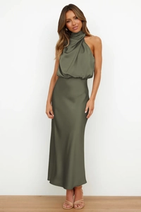 Detail of elegant olive green satin maxi dress with a halter neck and sleeveless cut
