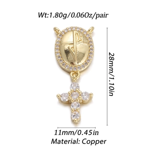 Detail view of 18K gold plated copper pendant with cross motif and zircon inlay