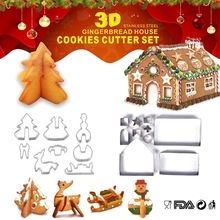 Macro detail of 3D gingerbread house stainless steel cookie cutters set with finished biscuits