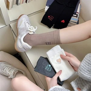 Detailed embroidery of Follow your heart text on stylish mid-calf cotton socks