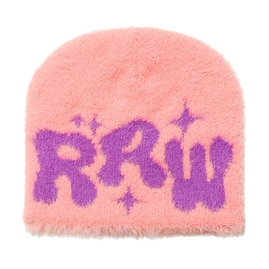 Detailed view of pink faux mink fur beanie with purple RRW letter and star embroidery