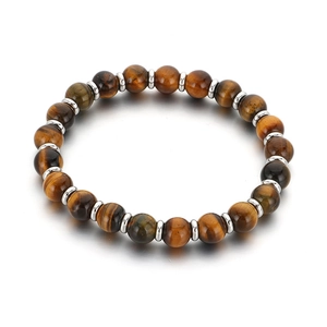 Tiger eye and volcanic stone elastic bracelet with silver beads on a white background