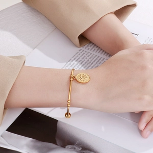 Bracelet jonc ouvert doré en acier inoxydable avec pendentif soleil et boules