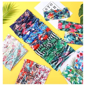 Detailed view of bohemian floral print elastic headbands in various tropical patterns