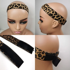 Detail of adjustable leopard print wig band with elastic fabric and hook-and-loop fastener