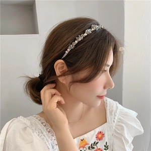Elegant crystal beaded headband with handmade rhinestones on a slim silver metal frame
