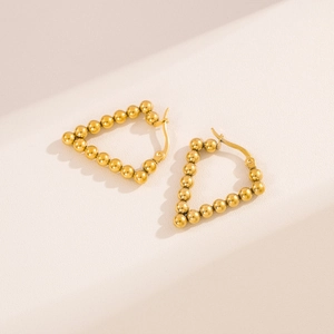 Golden V-shaped bead earrings in polished stainless steel for a modern street style look