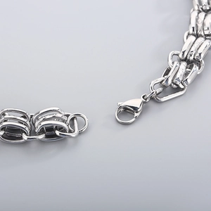 Detail view of silver stainless steel wide chain necklace with secure lobster clasp closure