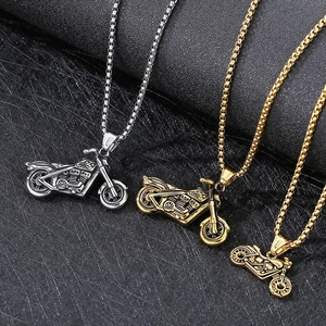 Three hip hop motorcycle pendants in silver, bronze, and gold finishes on box chains