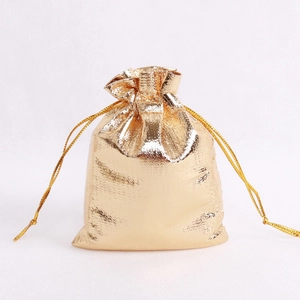 Metallic gold drawstring gift pouch for jewelry packaging and elegant small item storage