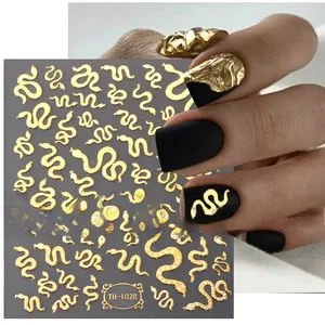 Detail of gold snake nail stickers TH-1028 with metallic 3D texture on black nails