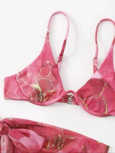 Detail of pink marble bikini top with ribbed texture and silver metal front buckle