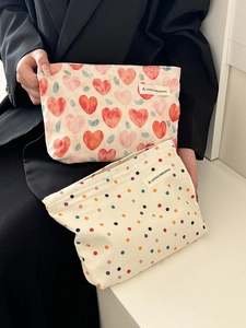 Cute canvas cosmetic bags with heart and polka dot patterns for makeup storage