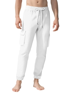 Detail of white cargo pants featuring drawstring waist and large side pockets on model