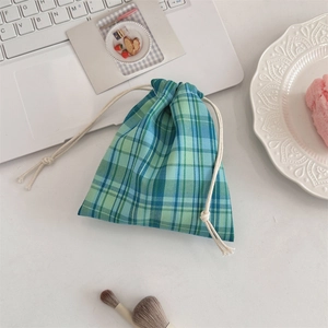 Blue-green checkered fabric drawstring pouch for jewelry and cosmetic storage