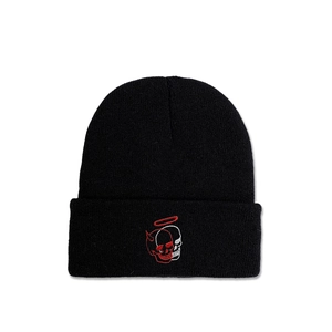 Detail of street style beanie showing high-quality knit texture and skull embroidery