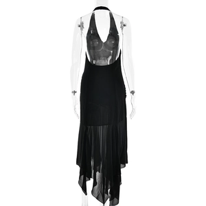 Detail of elegant black halter neck dress with deep V-neck and asymmetric draped hemline