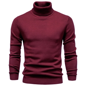 Detailed view of the ribbed knit turtleneck and burgundy fabric texture of the men's sweater